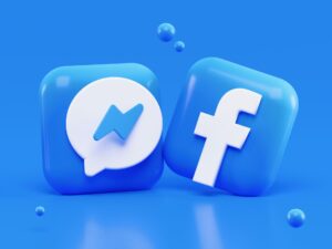 Un disegno in 3d dei loghi di facebook e messenger su sfondo azzurro.
