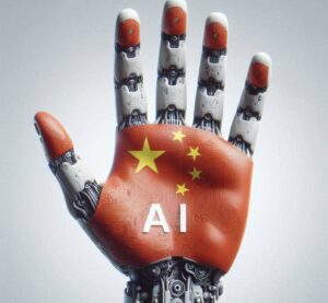 Immagine di una mano robot molto simile a quella umana con sul palmo della mano rappresentata la bandiera cinese con la scritta "AI". Immagine generata tramite DALL-E 3 da Marta Baronio